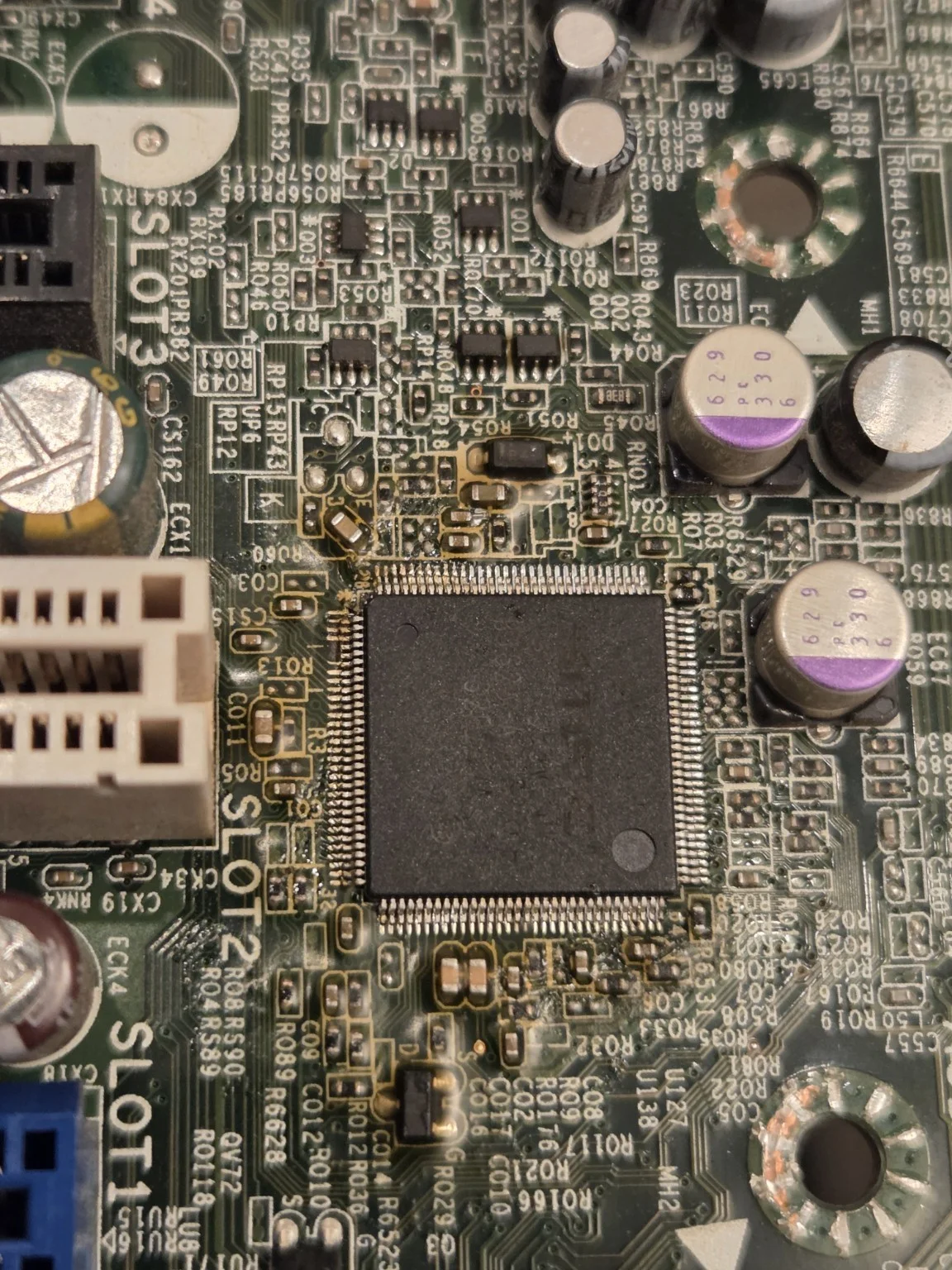 Fine-pitch component and surrounding motherboard circuitry