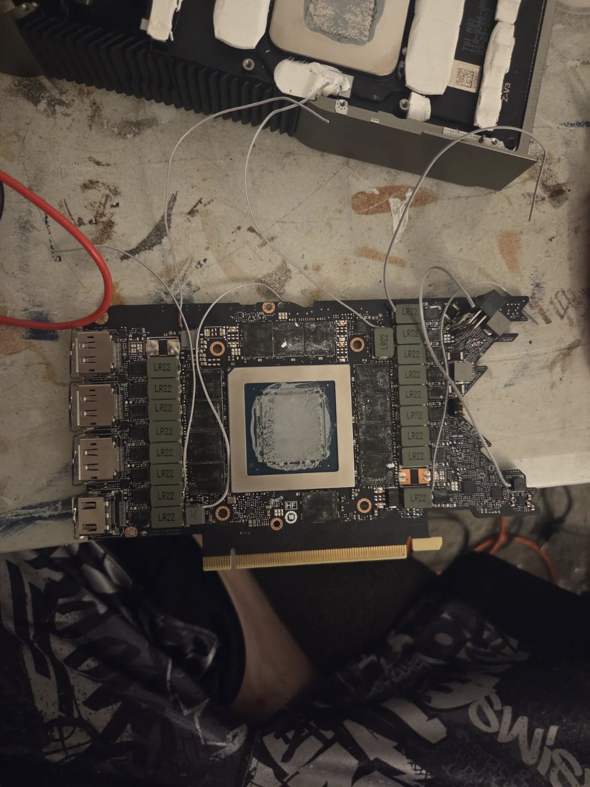 Graphics card on the bench with diagnostic test leads